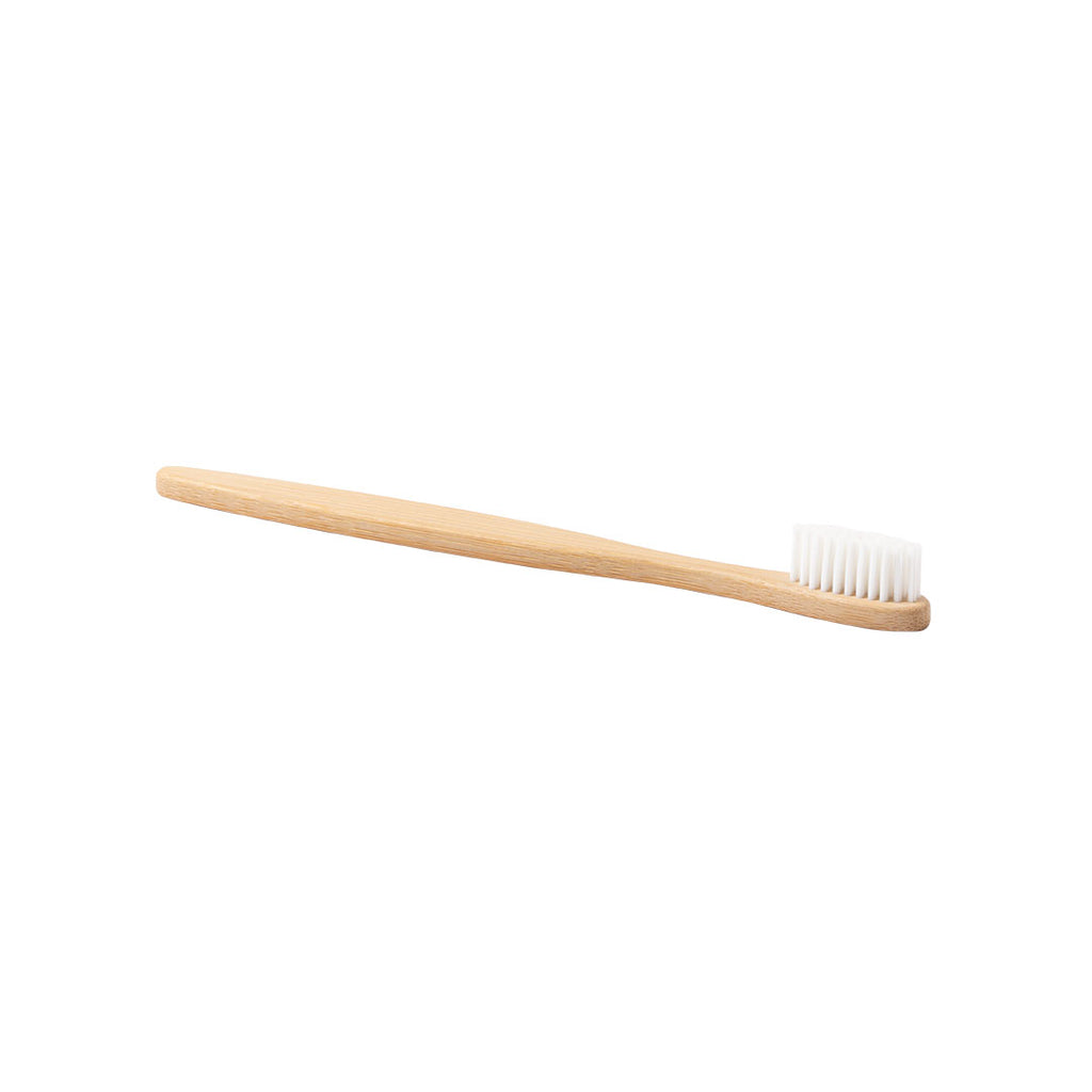 Set dentaire avec brosse à dents et dentifrice. Brosse à dents fabriquée en bambou. Dentifrice inclus avec bouchon à vis.