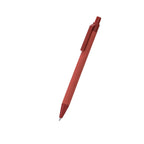 Stylo rouge fabriqué en carton recyclé en combinaison avec de la paille de blé. Mécanisme à pression et encre bleue